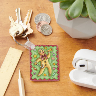 Porte-clés Joli bonhomme en pain d'épices soufflant dans un c