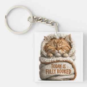 Porte-clés Joli chaton roux endormi enveloppé dans une couver