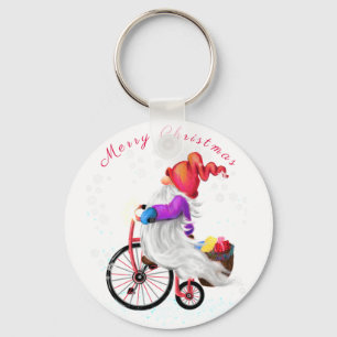 Porte-clés Joyeux Noël - Gnome drôle avec vélo et cadeaux