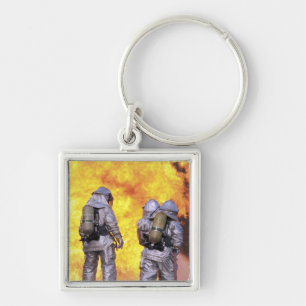 Porte-clés Les pompiers éteignent un incendie d'avion