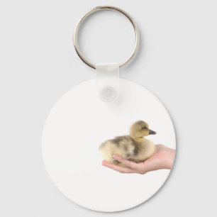 Porte-clés little goose in one hand