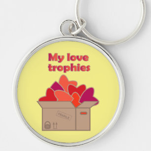 Porte-clés Mes trophées d'amour dans une boîte pleine de coeu