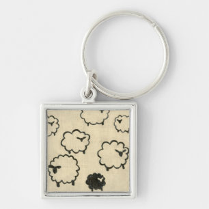 Porte-clés Mouton blanc et noir sur Arrière - plan crème