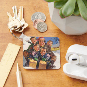 Porte-clés Noël vintage, famille heureuse faisant de la luge