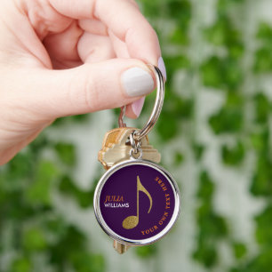 Porte-clés note de musique d'or sur porte - clé violet avec n