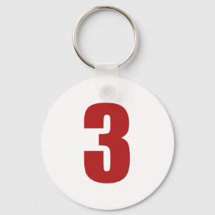 Porte-clés Numéro 3 en rouge sur le bouton blanc porte - clé
