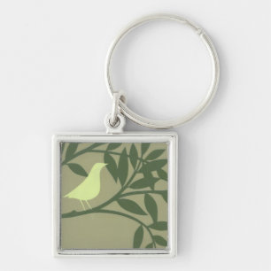 Porte-clés Oiseau vert perché sur une branche verte