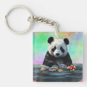 Porte-clés Panda regarde un groupe coloré de poissons nageant