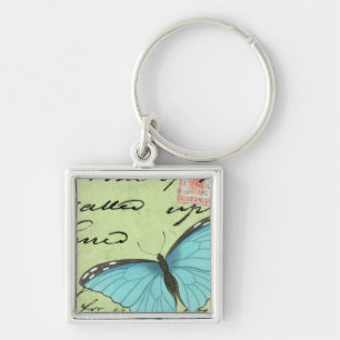 Porte-clés Papillon à ailes bleues sur carte postale Turquois
