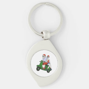 Porte-clés Père Noël et Mme Claus chevauchant un scooter