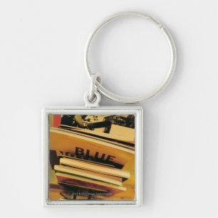 Porte-clés Pile de livres et de magazines