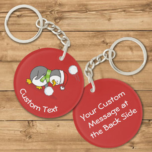 Porte-clés Pingouin de Noël Attrapant une Boule de