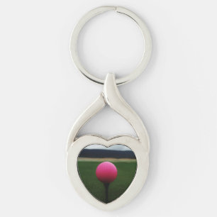 Porte-clés Pink Golf Ball sur un terrain de golf de montagne