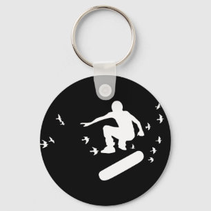 Porte-clés planche à roulettes. planche avec des oiseaux.