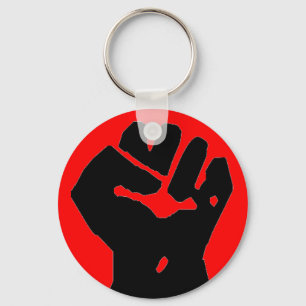 Porte-clés poing noir sur le porte - clé rouge