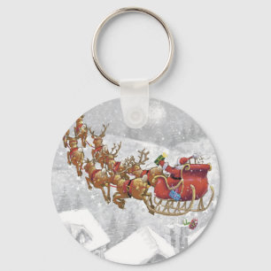 Porte-clés Santa Claus riding on sleigh with gift box