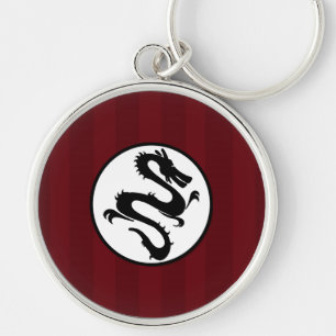 Porte-clés Silhouette de dragon noir sur les rayures rouges