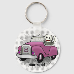 Porte-clés Singe chaussette conduisant une voiture