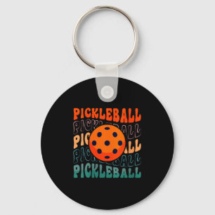 Porte-clés Style rétro féminin de pickleball en agitant un pi