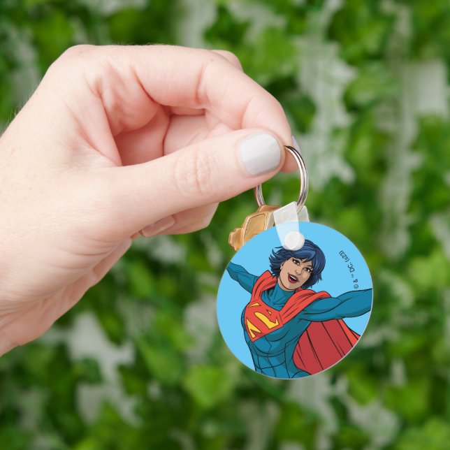 Porte-clés Supergirl volant en costume bleu (main)