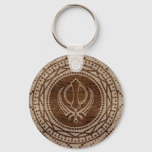 Porte-clés Symbole Khanda sur la texture en bois