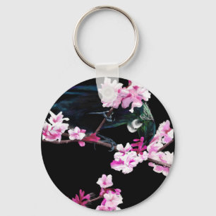 Porte-clés Tui Bird dans les fleurs de cerisiers