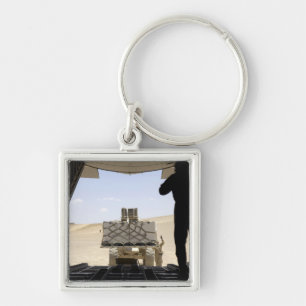 Porte-clés Un chariot élévateur charge la cargaison sur C.A