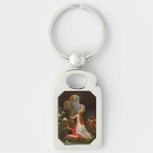 Porte-clés Une femme avec une croix est en prière