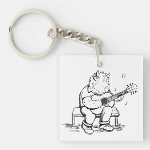 Porte-clés Vache des Highlands jouant de la guitare acoustiqu