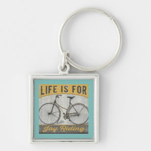 Porte-clés Vélo vintage avec la citation