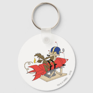 Porte-clés Wile E. Coyote lançant une fusée rouge