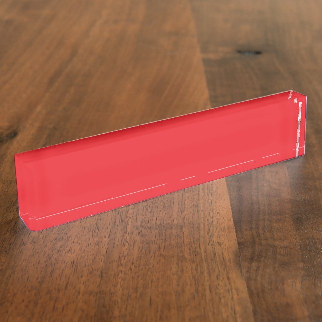 Porte-nom crayons rouges et oranges couchés côte à côte sur  (Taille)