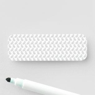 Porte-nom un arrière - plan blanc avec un motif au milieu