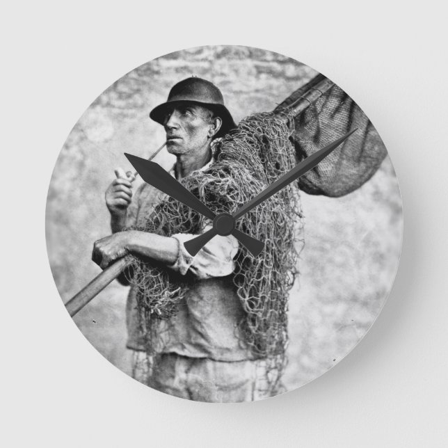 Portrait of a Fisherman Carrying his Nets (b/w pho Round Clock (Front)