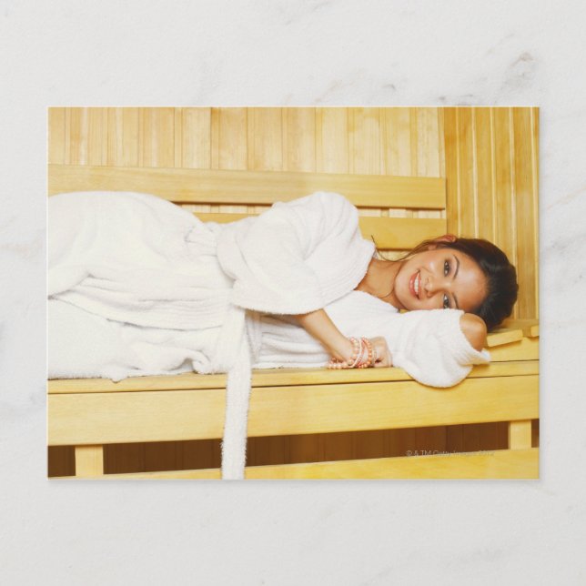 Portrait of a young woman lying in a sauna postcard (Front)
