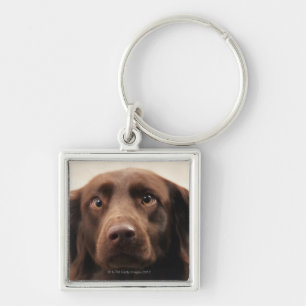 Portrait of an apprehensive young female keychain