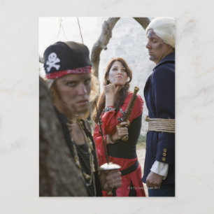 Portrait of pirates holding and threatening a postcard