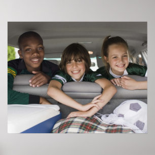 Portrait of smiling children in car poster