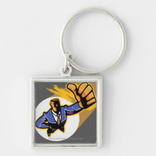 Portrait of young man showing thumbs up keychain
