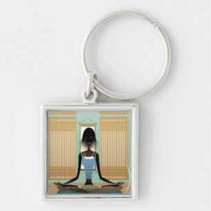 Portrait of young woman doing yoga keychain