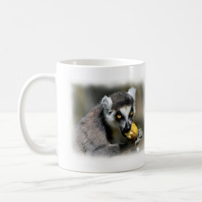 Portrait ring-tailed lemur eating a banana coffee mug (Left)