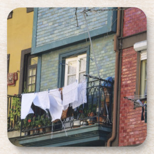 Portugal, Oporto (Porto). Woman hanging laundry Coaster