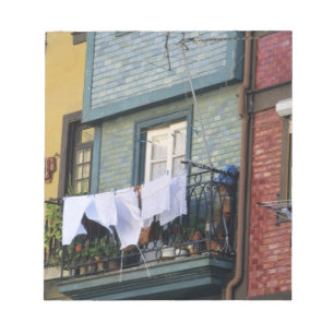 Portugal, Oporto (Porto). Woman hanging laundry Notepad