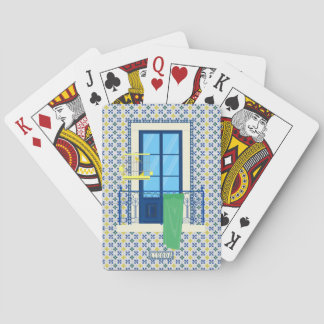 Portuguese tiles and window balcony with bird playing cards