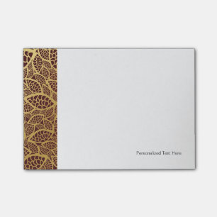 Post-it® Dentelle en feuilles d'or sur arrière - plan rouge