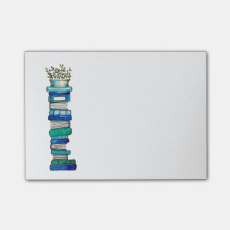 Post-it® Notes collantes de pile de bleu et de Livre vert