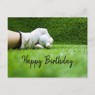 Postale Golfeur tient une balle de golf sur une carte d'an