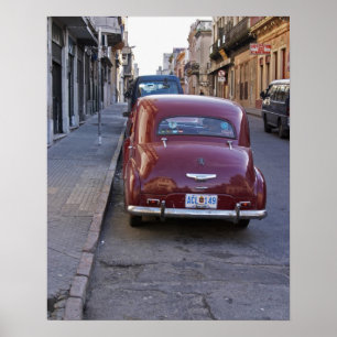 Poster A classic old red Peugeot car parked on a street