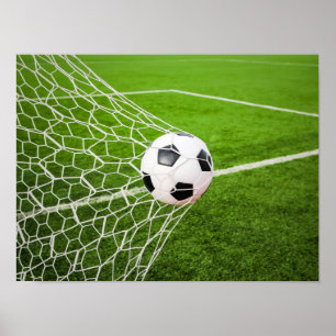 Poster Ballon de football frappant le filet de but