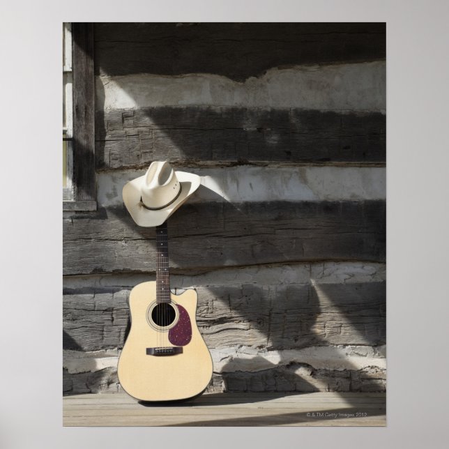 Poster Cowboy casquette sur guitare s'appuie sur le cabin (Devant)